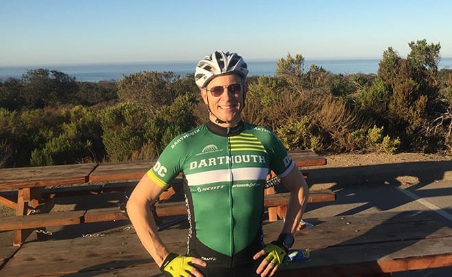 Hueston_Bike - Hueston in biking gear overlooking ocean