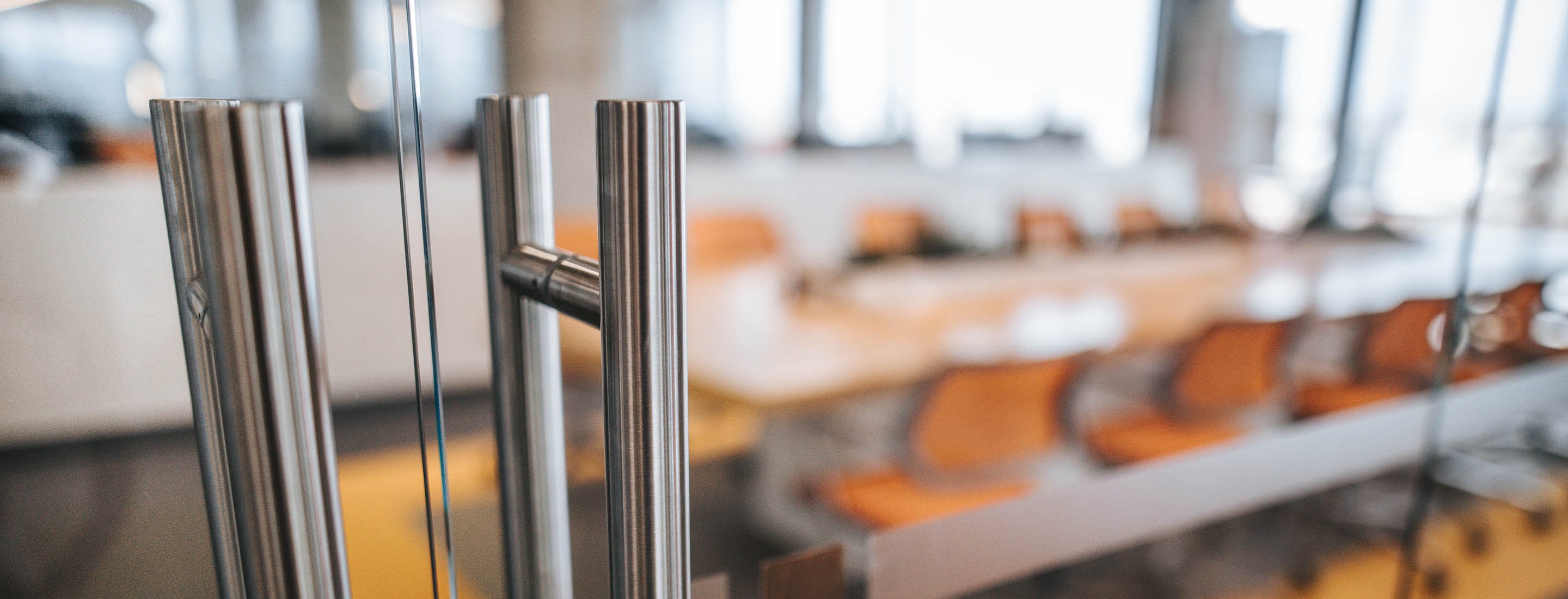False Claims - conference room with glass doors in focus
