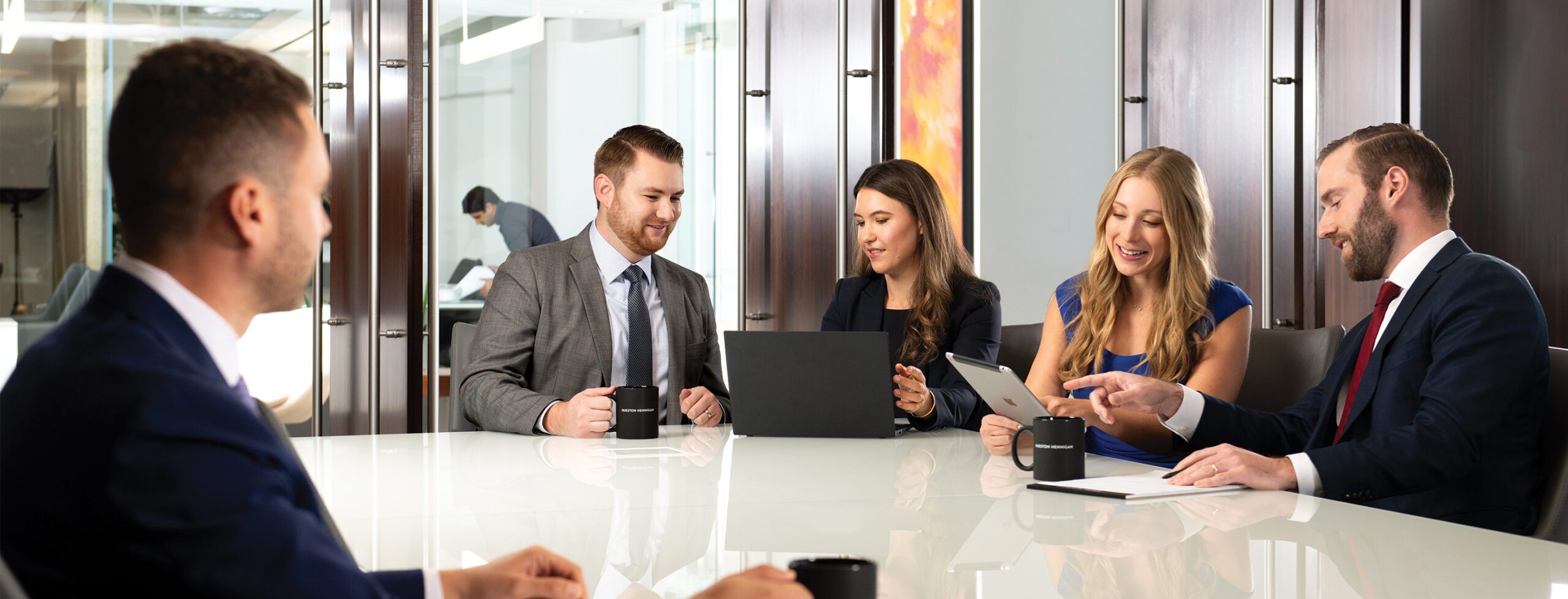 People sitting around a conference room table