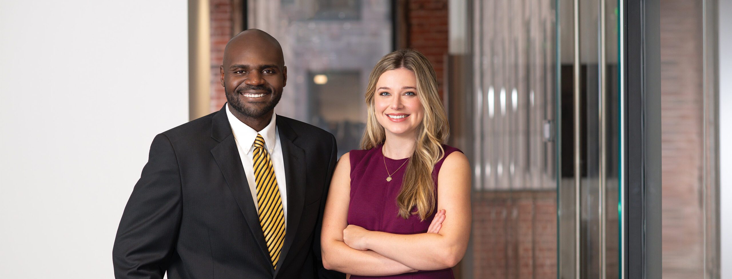 two people standing looking at camera