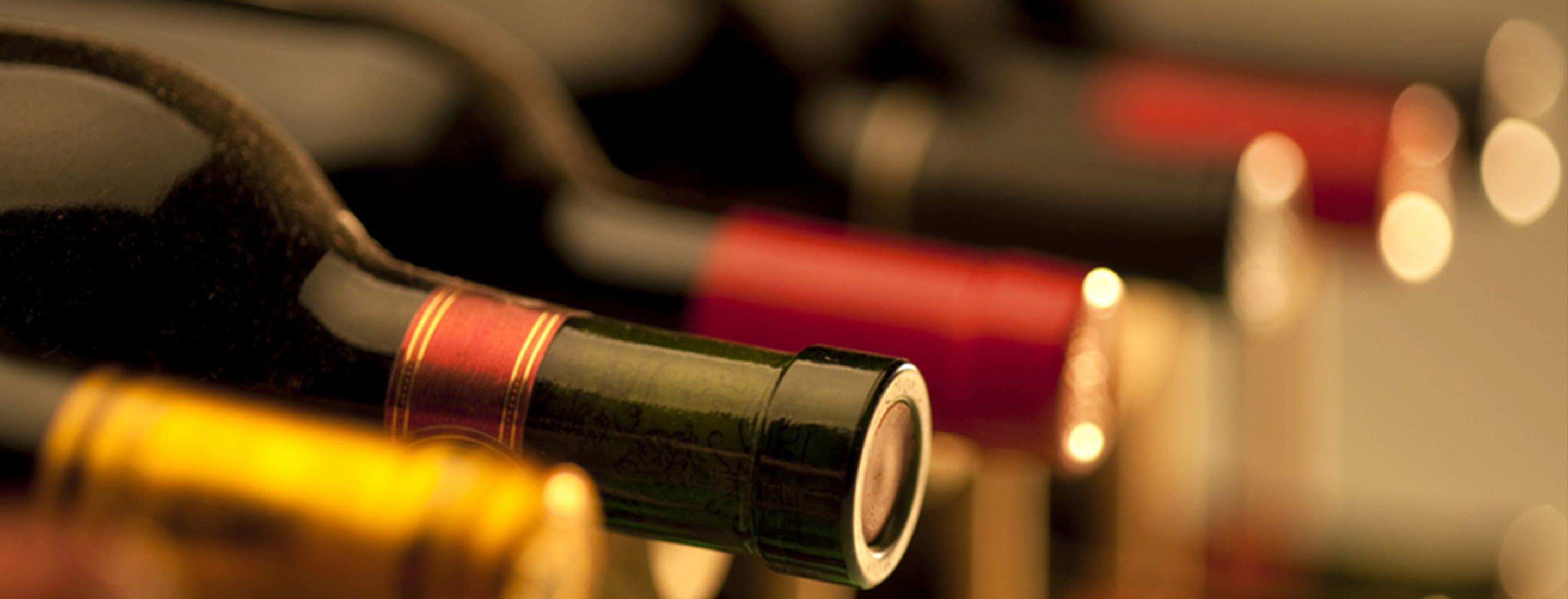 Picture of wine bottles on their side - focus on corks