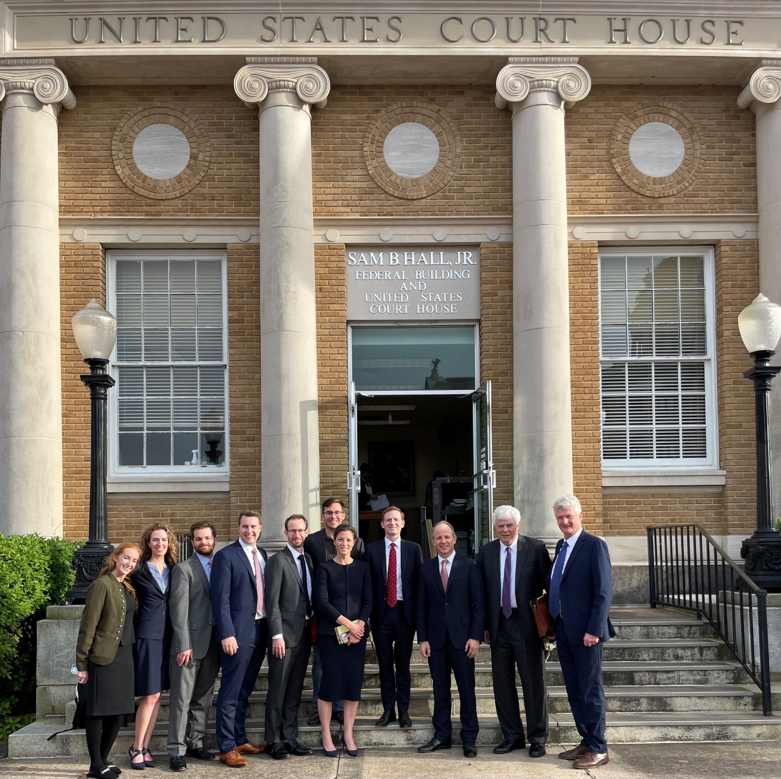 Acorn Trial Team outside of Sam Hall Jr Federal Building